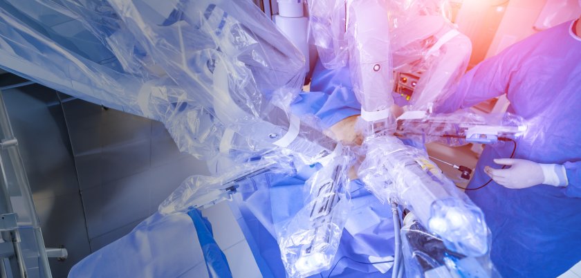 A surgeon performs a procedure with a robot-assisted surgical device.