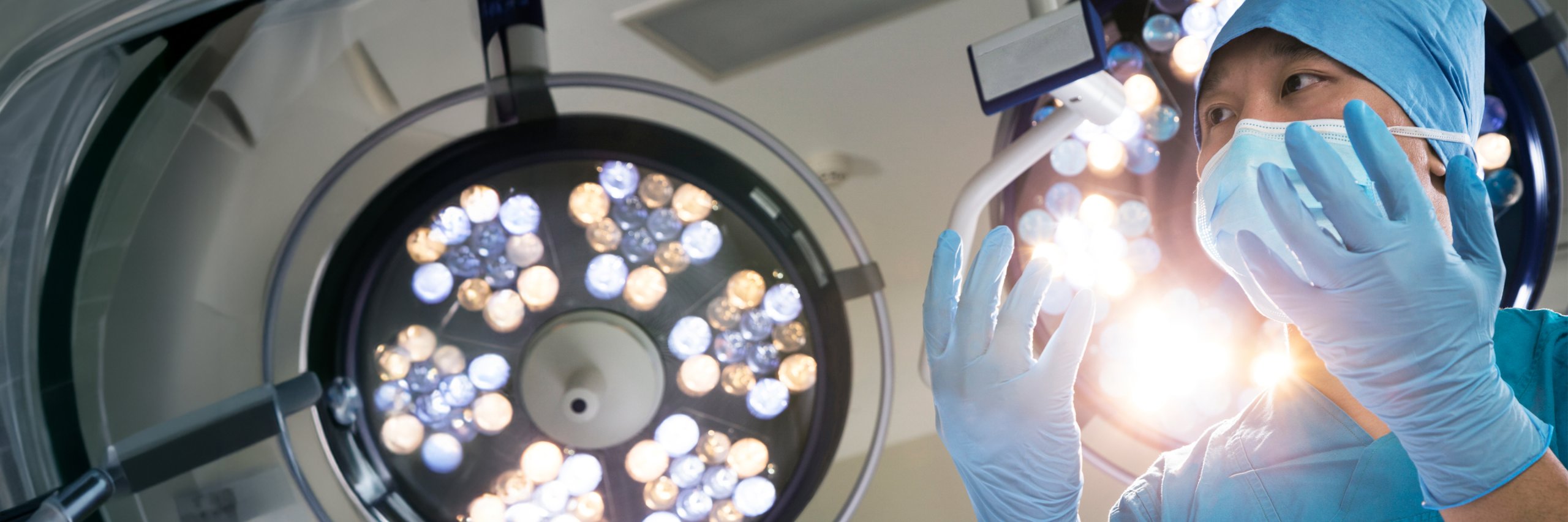Surgeon in operating room with surgical light